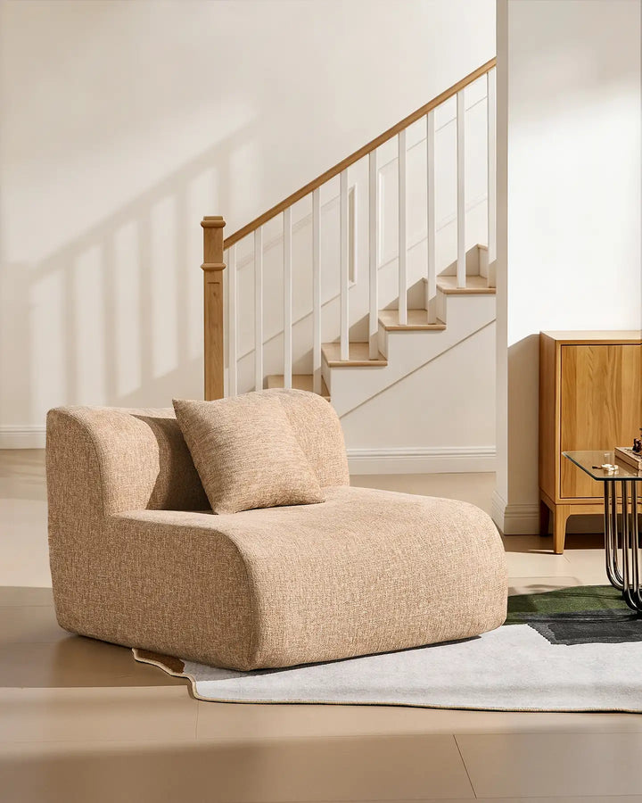 The standalone middle module of the Nola sofa used as a stylish accent armchair in a minimalist lounge.