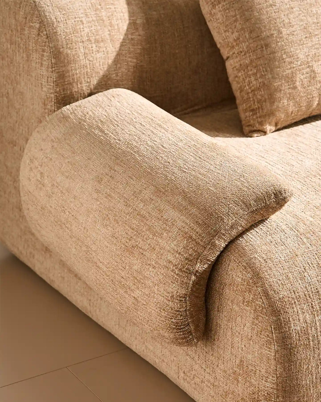 Luxury khaki chenille fabric texture of the Nola sofa, durable and soft-to-the-touch.