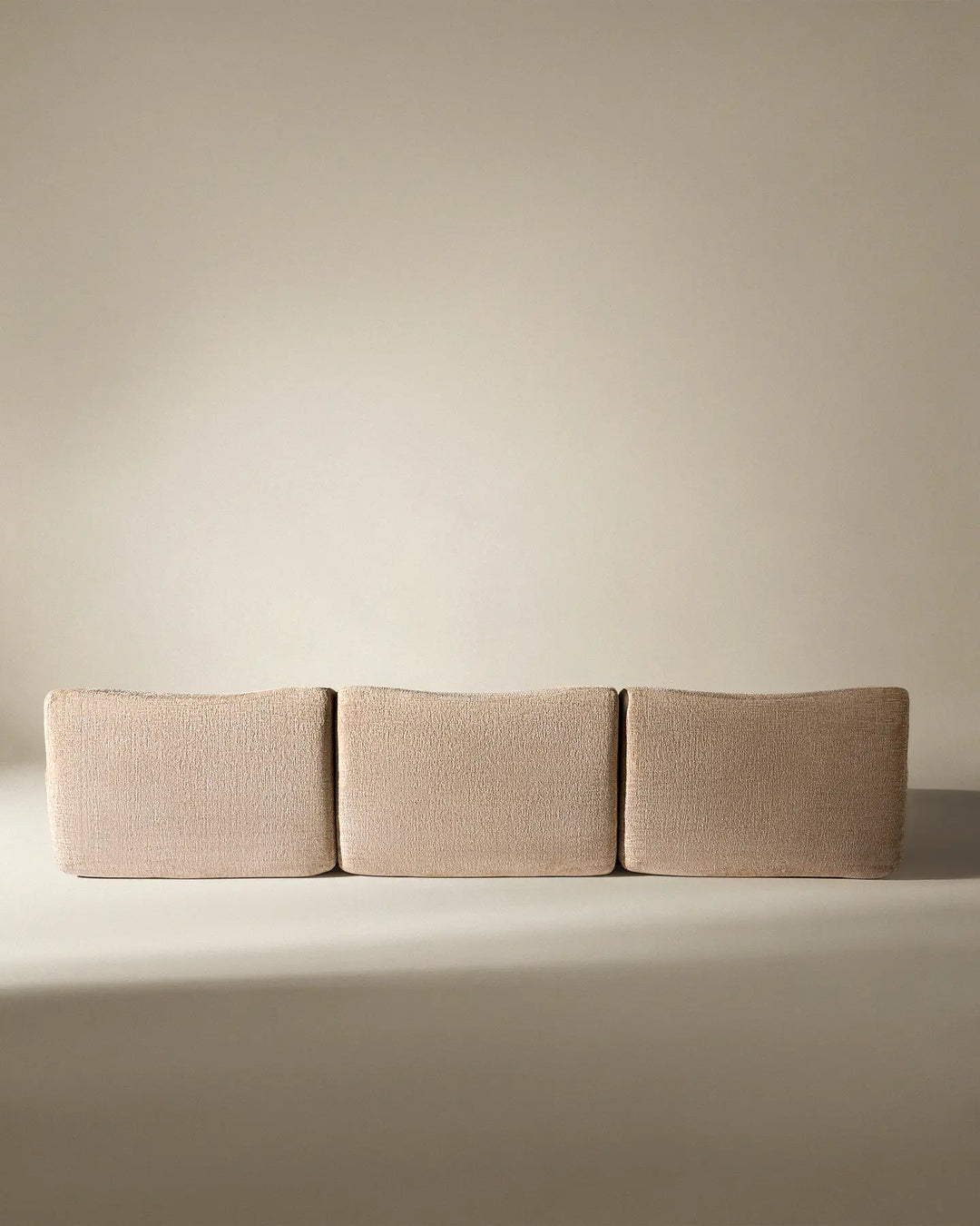 Rear view of the Nola sofa, showcasing the clean, finished back suitable for open-plan living spaces.