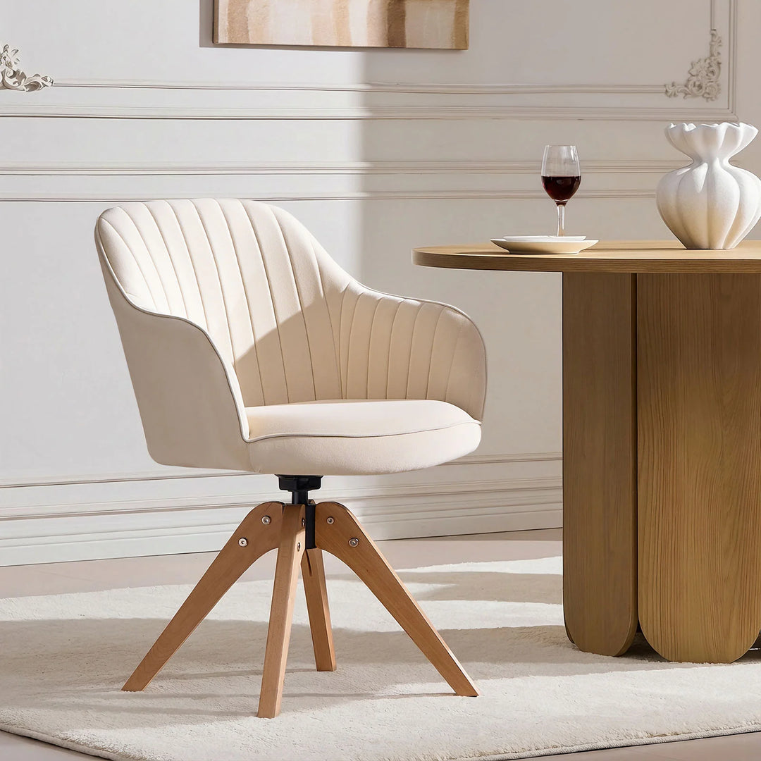 Single beige Oakley swivel chair at a dining table, featuring a bucket-style seat and stitched back for comfort and minimalist style