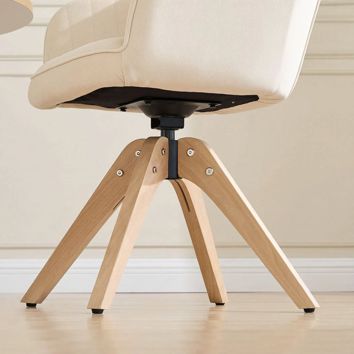 Beige Oakley velvet swivel chair with solid wood legs and 360-degree swivel base for durability and ease of use