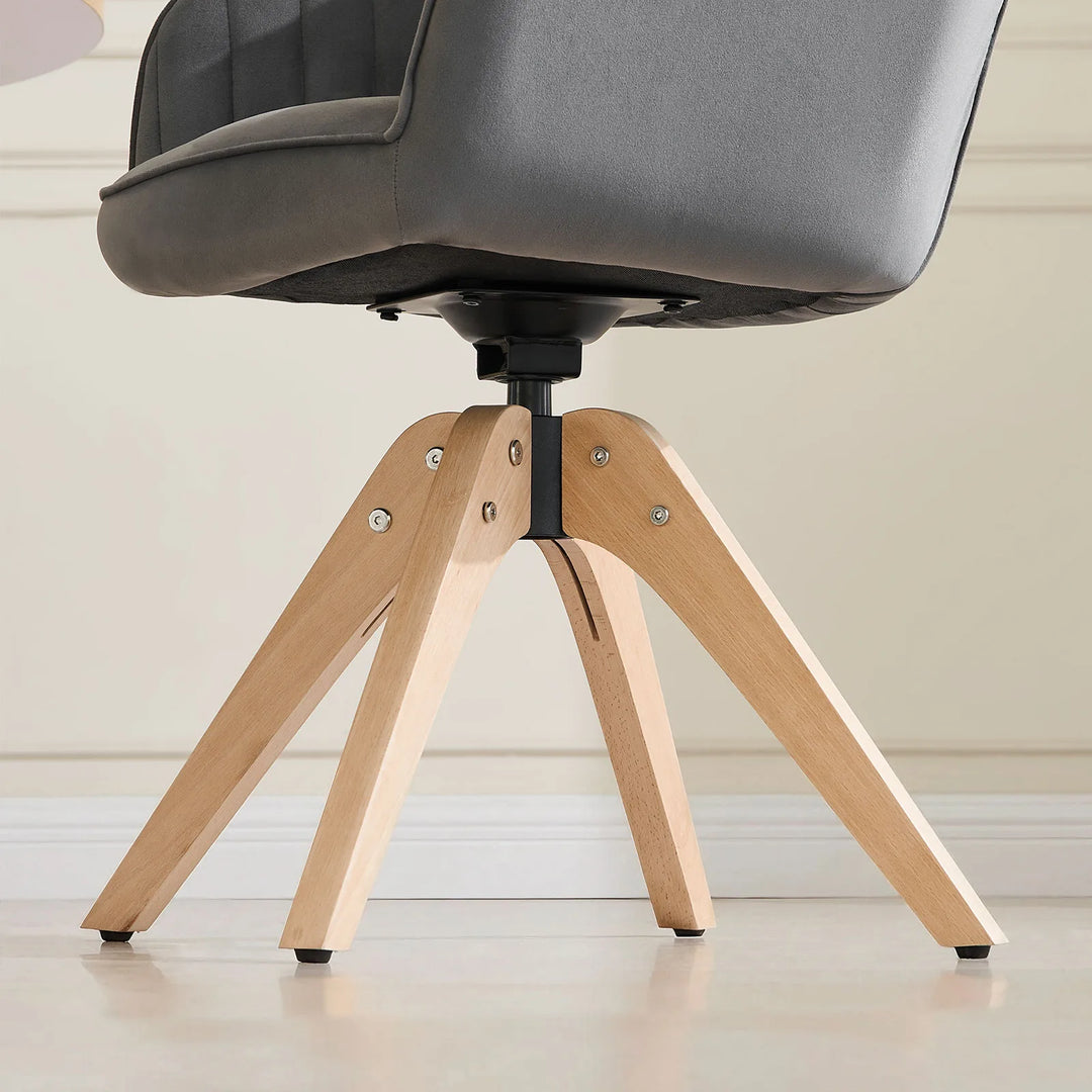 Grey Oakley velvet swivel chair with solid wood legs and 360-degree swivel base for durability and ease of use