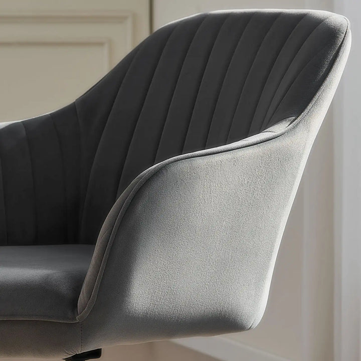 Armrest and seat detail of the grey Oakley velvet swivel chair, with soft velvet fabric for added comfort