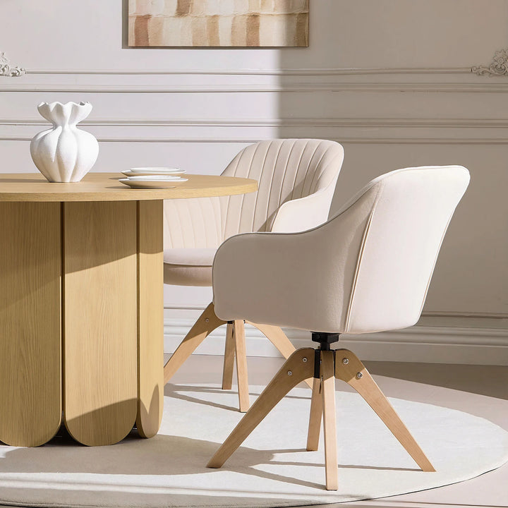 Pair of beige Oakley swivel dining chairs positioned at a dining table