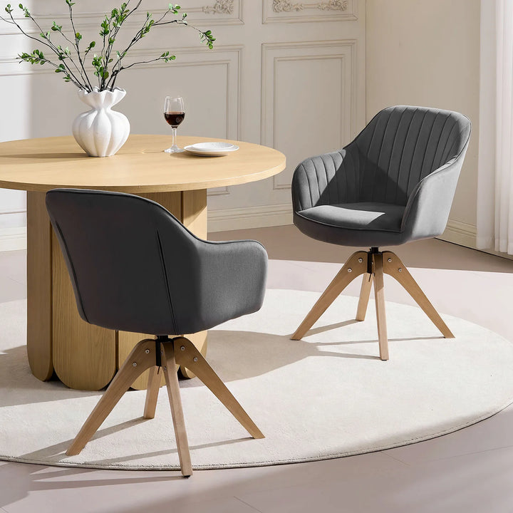 Two grey Oakley swivel chairs placed at a dining table in a modern dining room