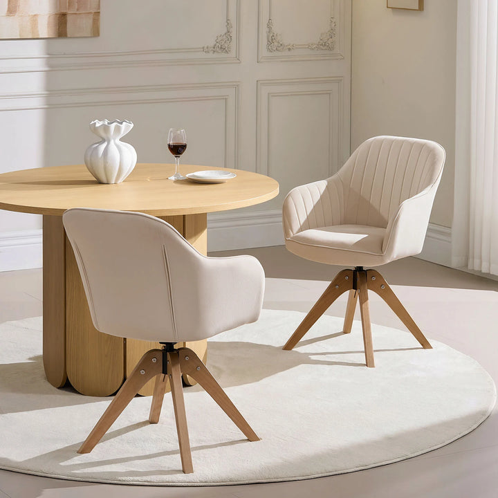 Two beige Oakley swivel chairs placed at a dining table in a modern dining room