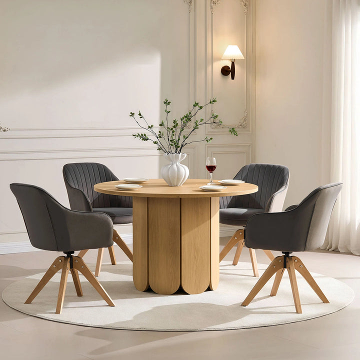 Set of four grey Oakley swivel dining chairs around a dining table, ideal for four to six people