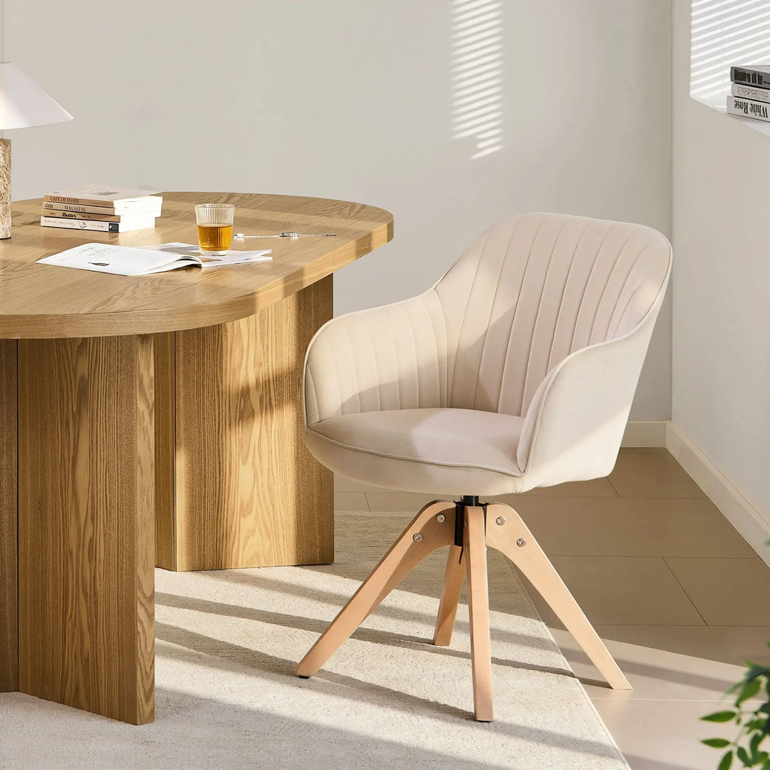 Beige Oakley swivel chair at a home office desk, showing the soft padded seat and supportive armrests