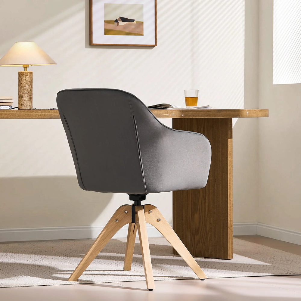 Grey Oakley swivel chair at a home office desk, highlighting the smooth curved backrest design