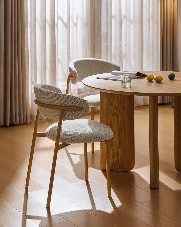 Rowan oak dining chairs paired with a round dining table, creating a welcoming mid century dining chair set for everyday meals