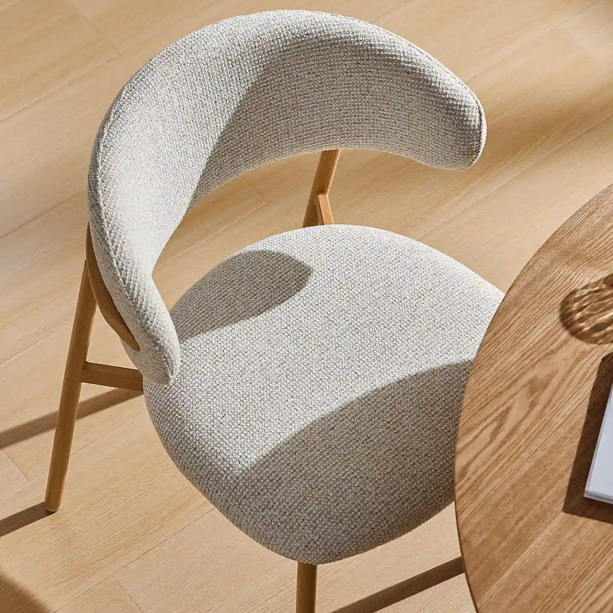 Overhead view of the Rowan wooden dining chair showcasing the padded seat and gently curved backrest