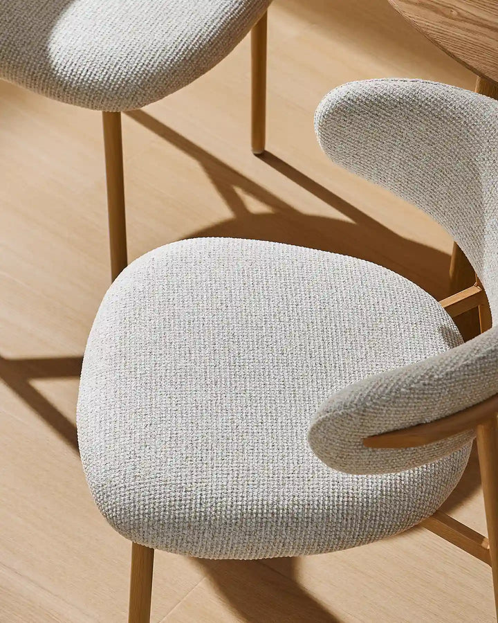 Overhead view of two Rowan dining chairs showing the comfortable upholstered seats and inviting design