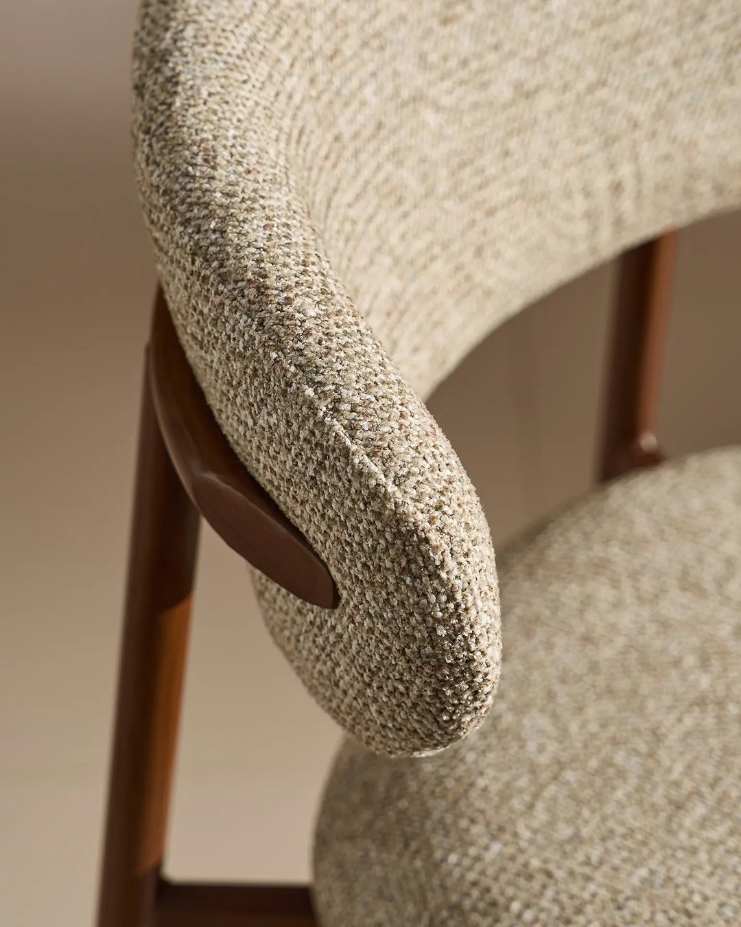 Curved backrest detail of the Rowan Walnut upholstered bar stool