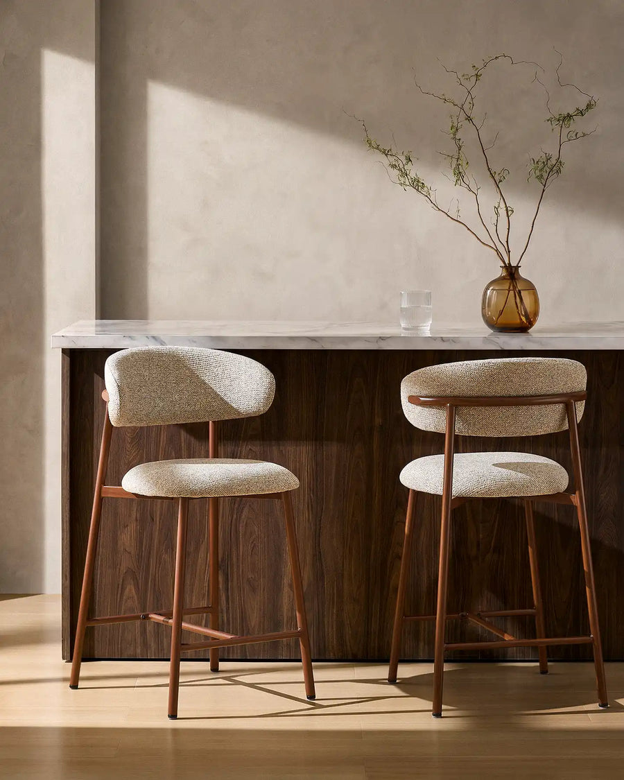 Two Rowan Walnut Bar Stools at a breakfast bar in a modern kitchen