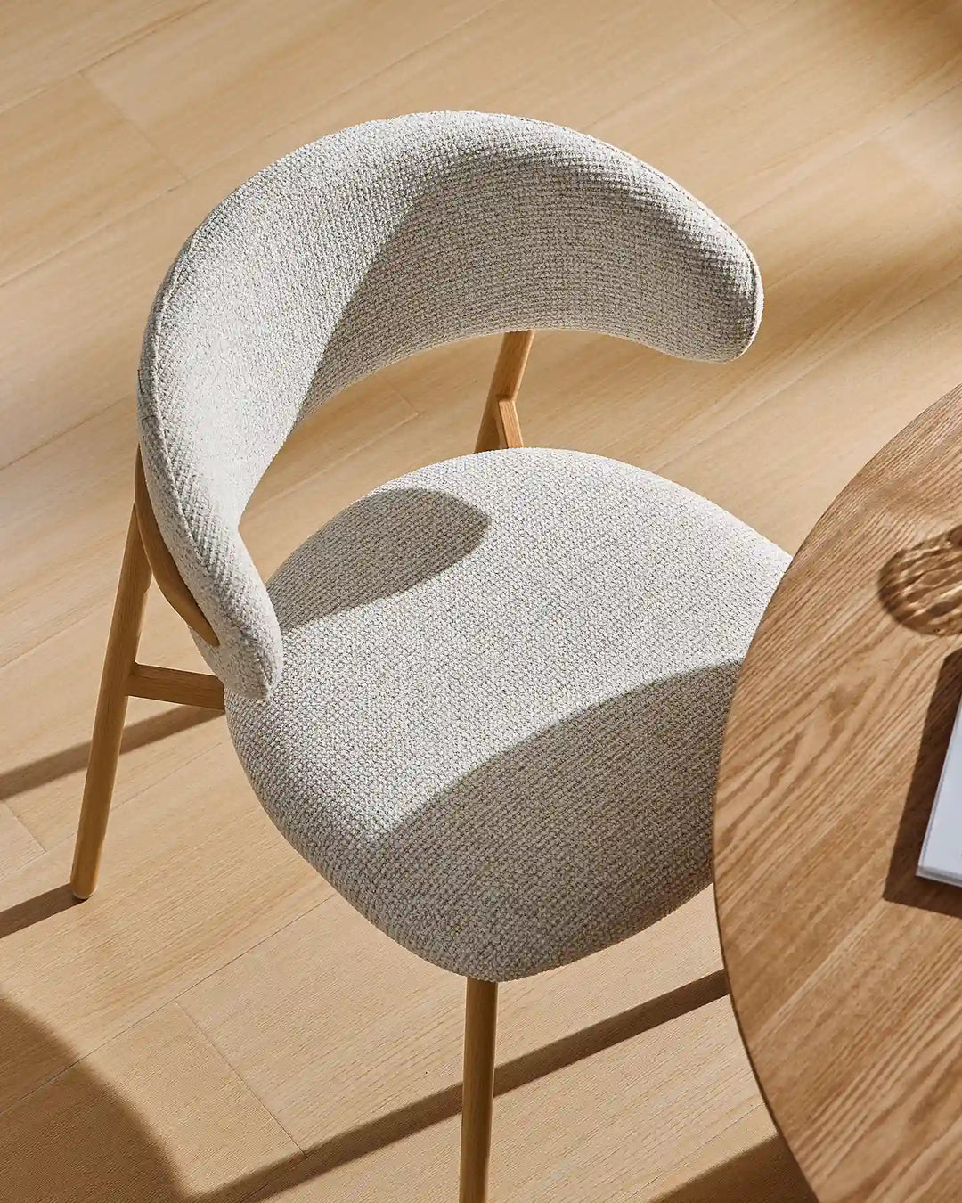 Overhead view of the Rowan wooden dining chair showcasing the padded seat and gently curved backrest