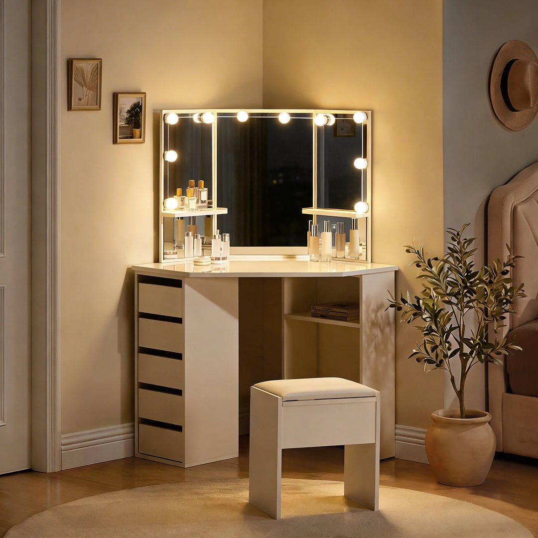 Roze white corner dressing table with LED lights and stool in a bedroom at night, warm lighting switched on