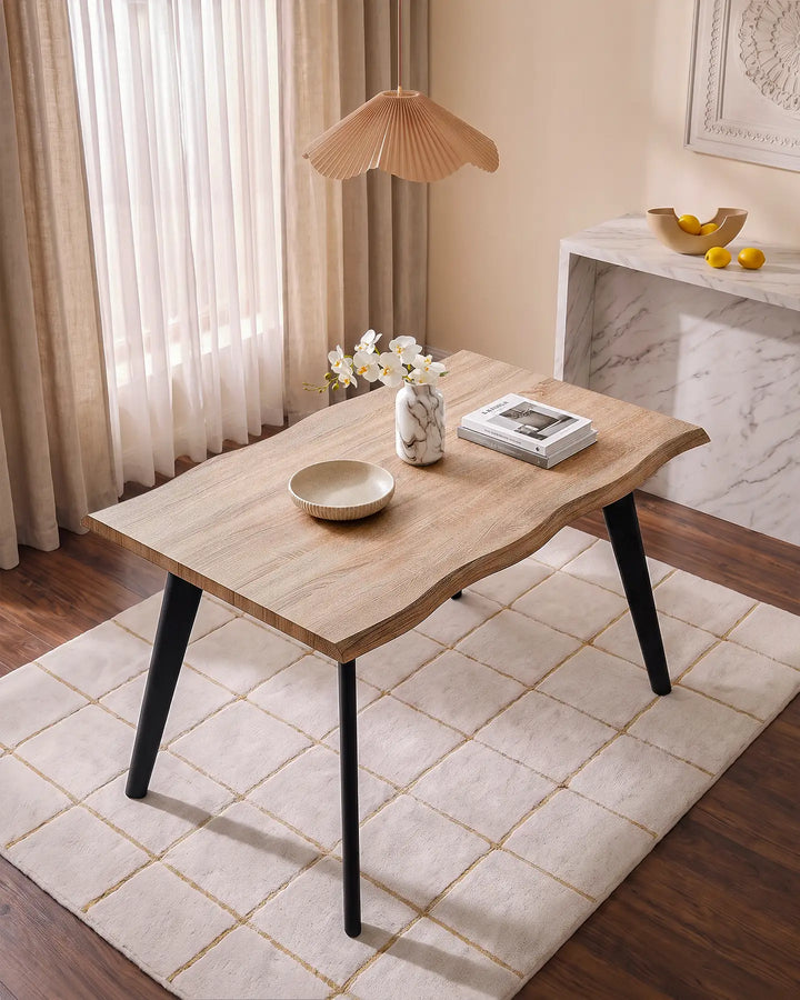 Seibold live edge dining table with natural wood-effect top and black tapered legs in a modern dining room
