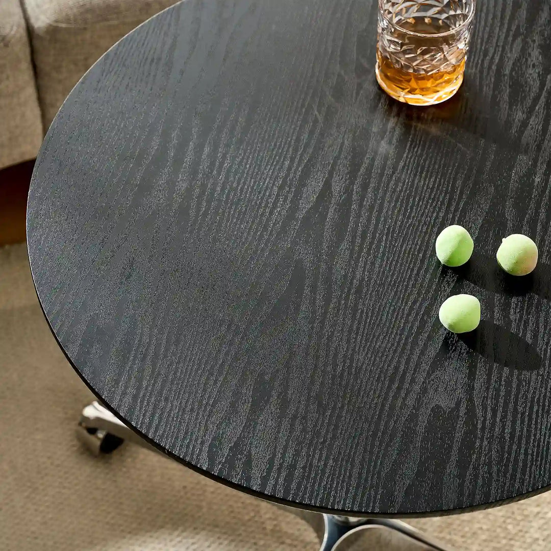 Close-up of Vesna Small Round Side Table black wood grain top, UK furniture with rich natural texture