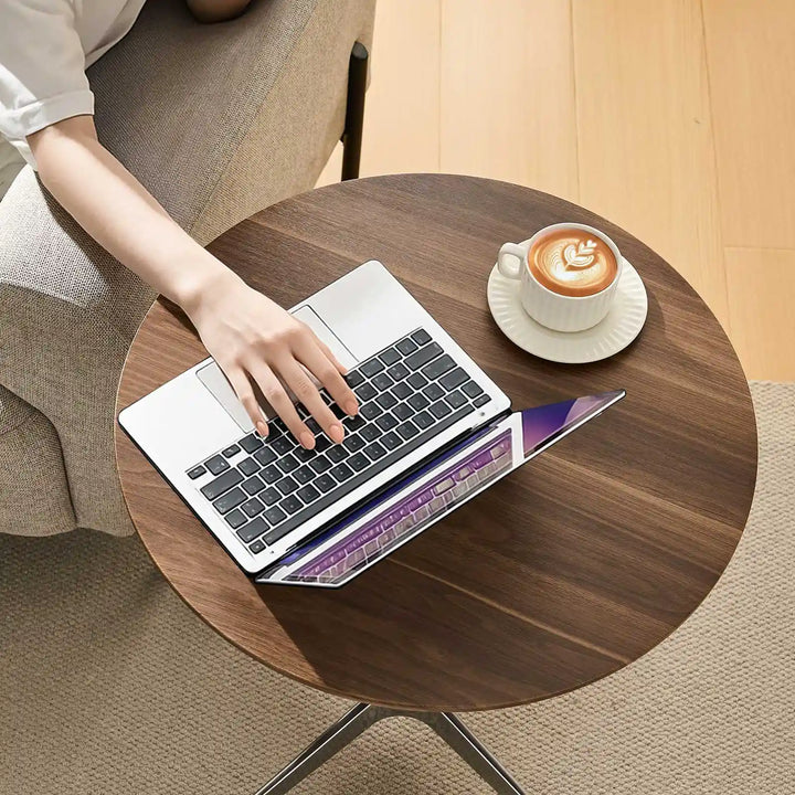 Working on laptop at Vesna Small Round Side Table, UK furniture for home office and study spaces