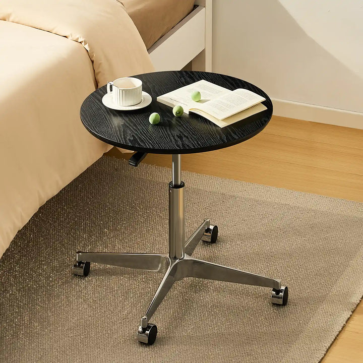 Vesna Small Round Side Table by bed in cozy bedroom, UK furniture height adjustable desk for small spaces