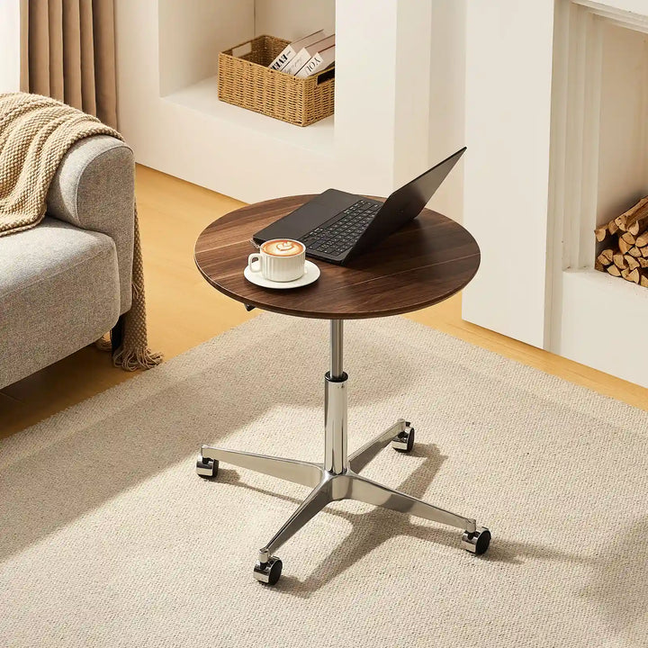 Top view of Vesna Small Round Side Table beside sofa, UK furniture with walnut top and round design