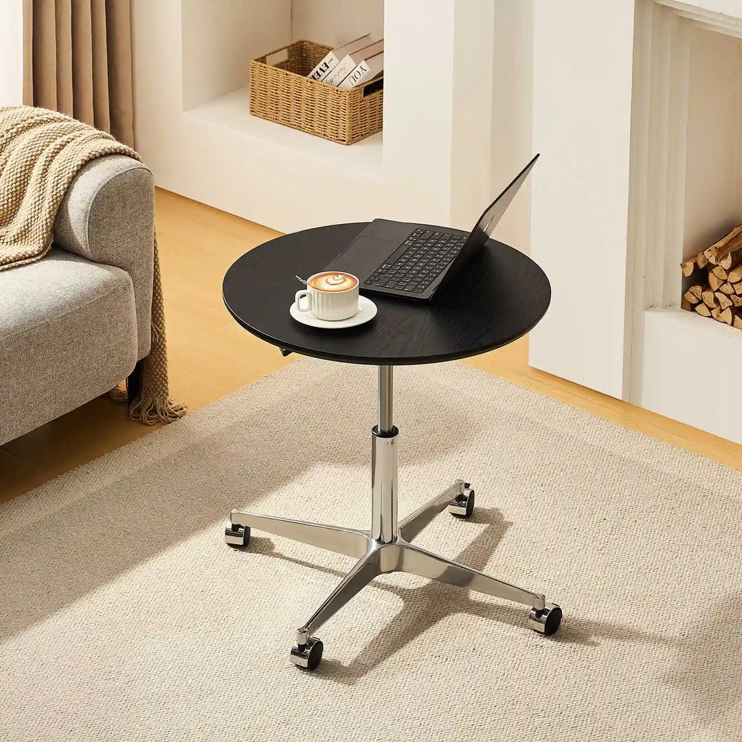 Top view of Vesna Small Round Side Table beside sofa, UK furniture with black top and round design