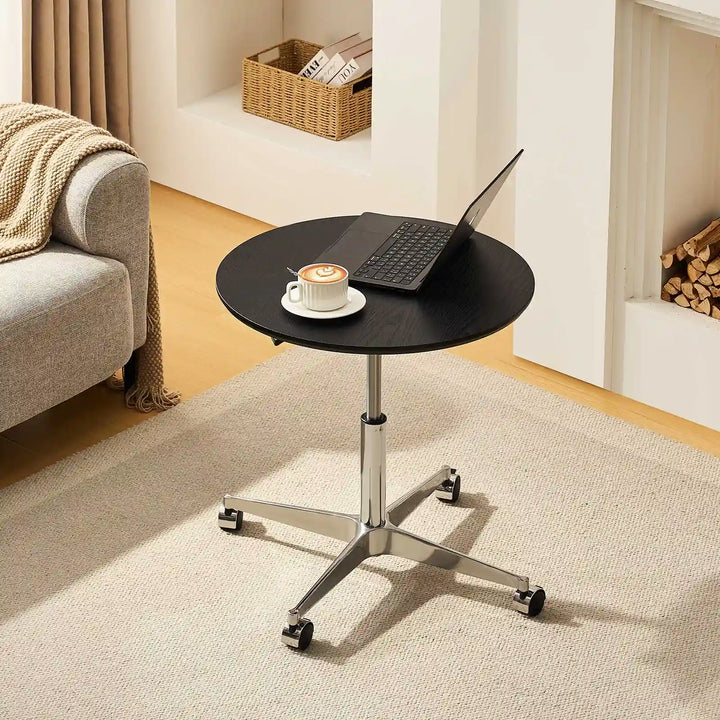 Top view of Vesna Small Round Side Table beside sofa, UK furniture with black top and round design
