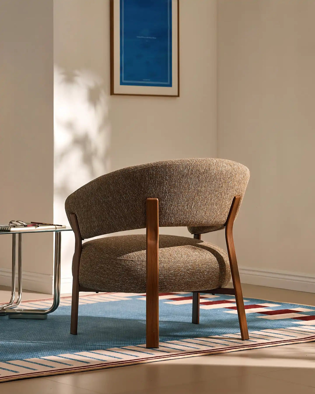 Rear view of the Bramley Accent Chair with walnut wood legs and curved backrest