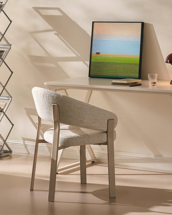 Bramley ivory upholstered armchair used as a rustic desk chair in a relaxed home office