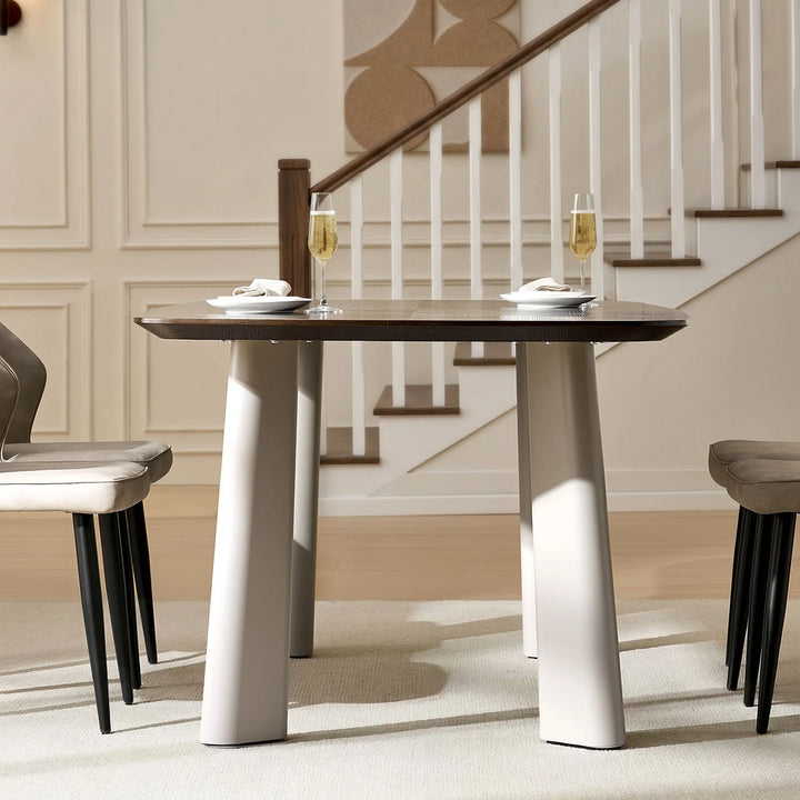 Side profile of Danforth dining table with 36mm thick tabletop and softly tapered metal legs