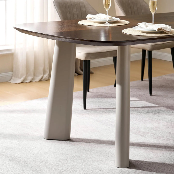 Side profile of Danforth dining table with 36mm thick tabletop and softly tapered metal legs