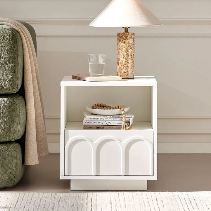 The Doris Side Table placed beside a sofa in the living room, creating a relaxed and modern living space.