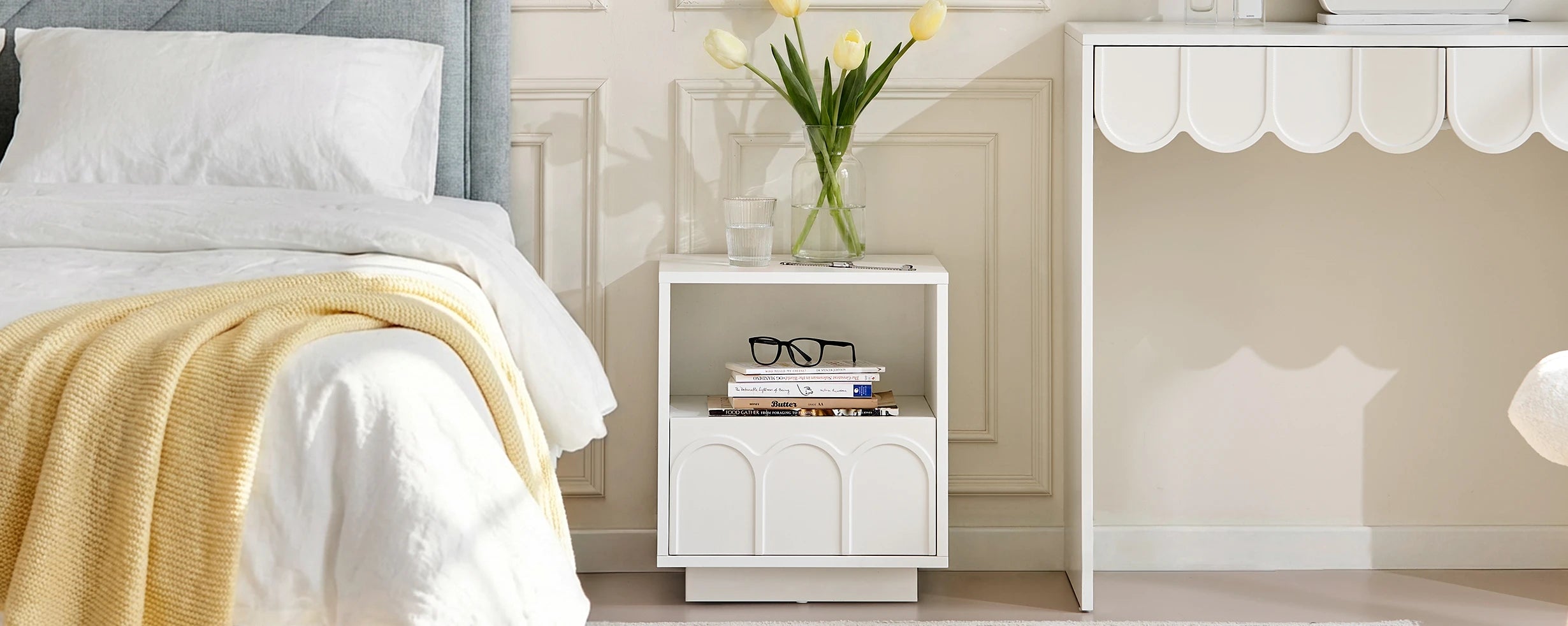 Doris Bedside Table styled beside the bed, creating a cosy and inviting bedroom atmosphere.