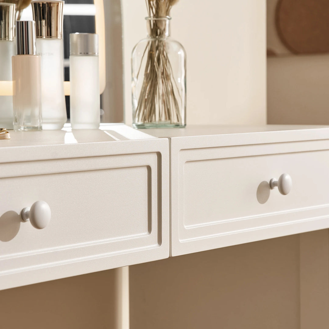 Details of Ceris vanity drawer fronts with round handles on the makeup table.