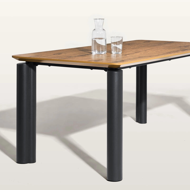 Dundas walnut veneer dining table with black metal legs isolated on white background