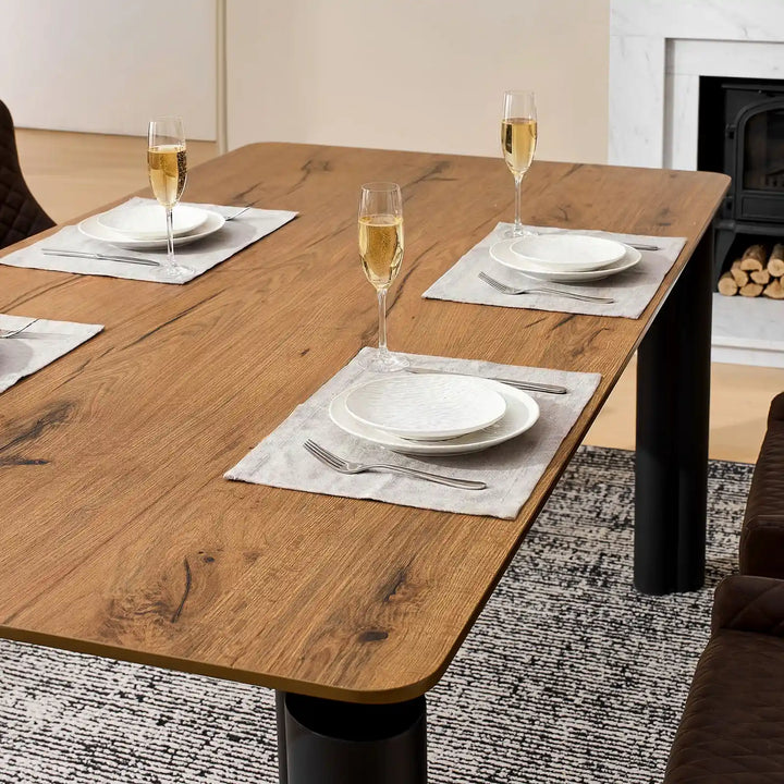 Close-up of Dundas walnut veneer dining table surface with realistic wood texture and visible grain detail