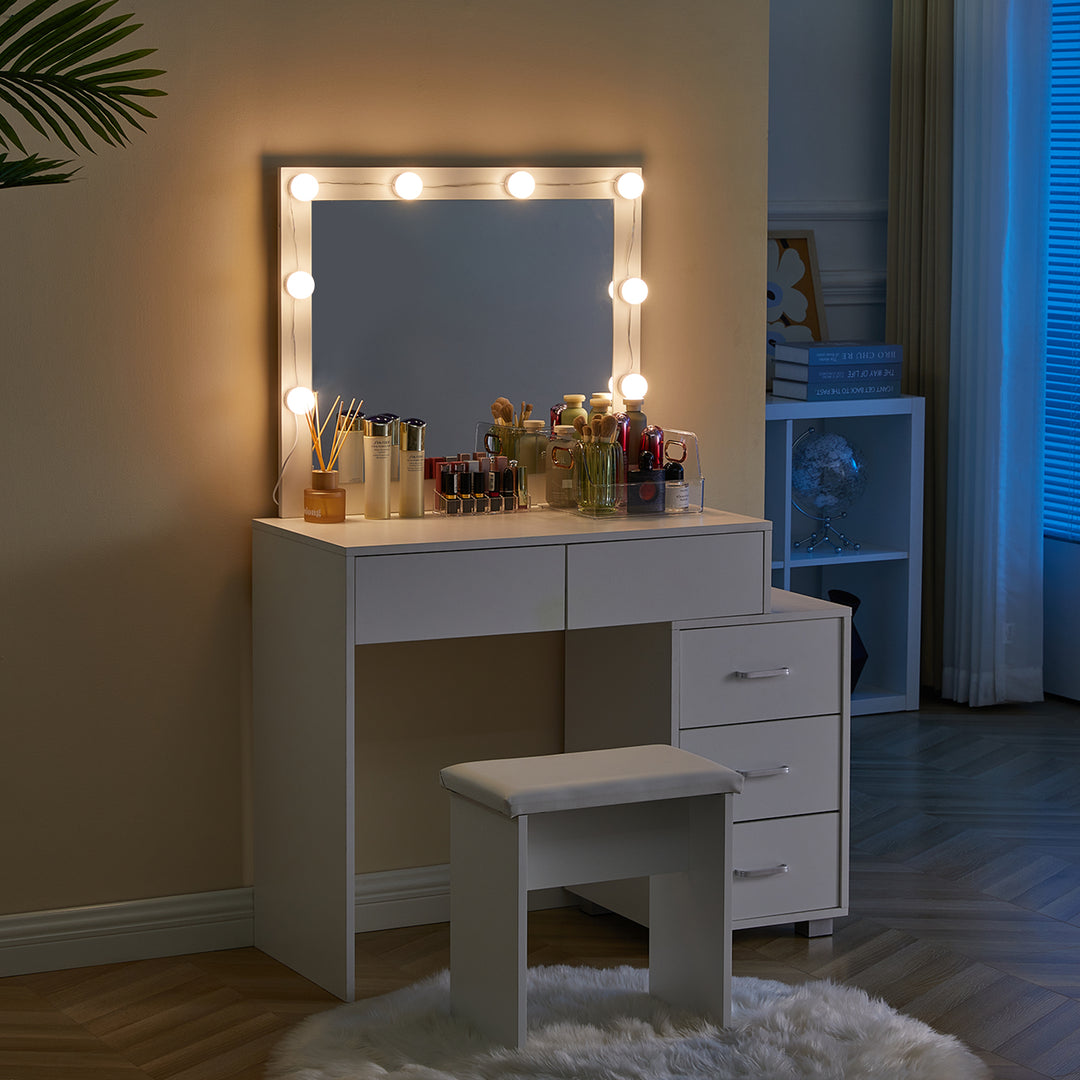The side view of the Aurora Dressing Table with a mirror, 8 bright LED bulbs， 2 drawers, a 3-drawer cabinet, and a stool, in a dark bedroom.
